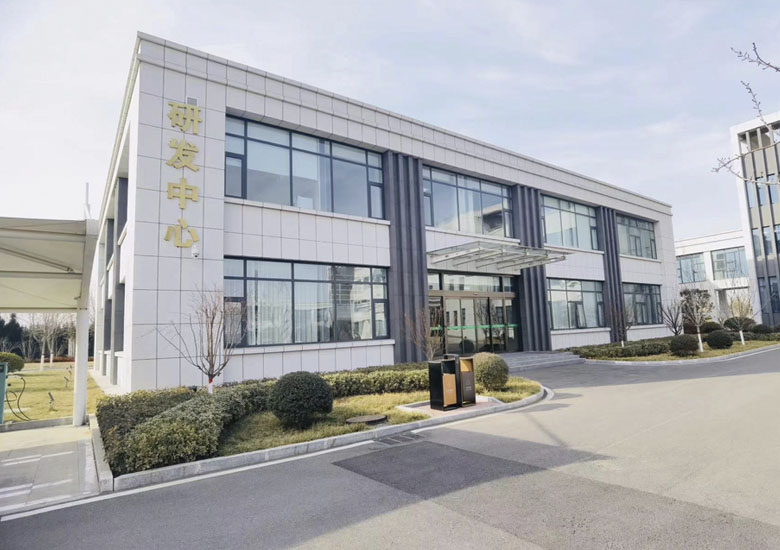 Lady in field looking to the sunset on the horizon